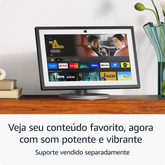 Controla lâmpadas, interruptores, tomadas, entre outros com a Echo Show 21, ecrã de 21". Faz videochamadas e vê conteúdos multimédia, como filmes e séries.